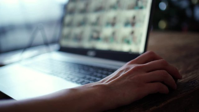 closeup womans hands programmer freelancer sitting home working using laptop, woman scrolling mouse, Surfs the Internet
