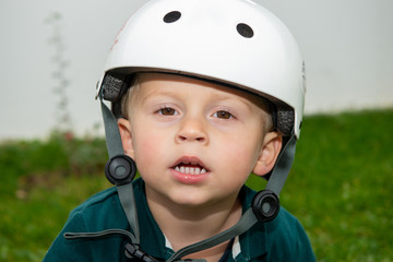 Fototapeta na wymiar portrait of young boy with helmet