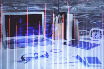 Double exposure of graph and financial info and work space with computer background. Concept of...