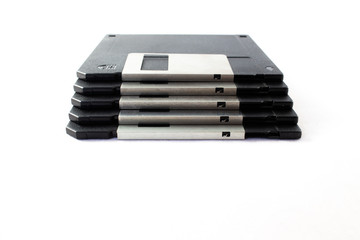 Front view of Floppy discs stacked on white background