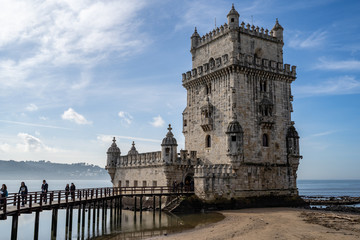 Fototapeta na wymiar Lisbon, Portugal - Tourists visit Belem Tower, a UNESCO World Heritage Site and fort