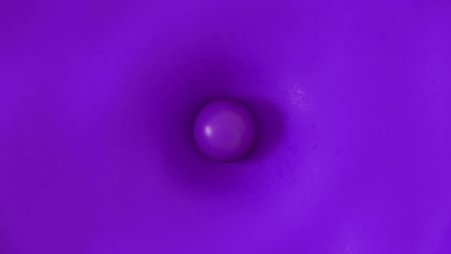 Abstract 3D ball falling on purple rubber flexion surface with waves around. Render animation of cloth texture material. 4k top view.