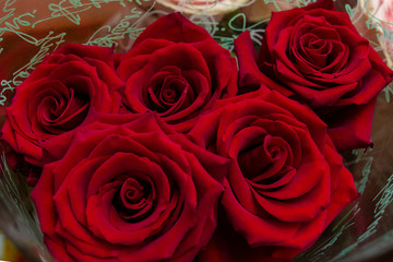 the best gift for a woman is a bouquet of bright red roses