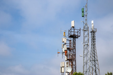 Lots of telecommunication towers for cellular network 4G, LTE and 5G antennas on the height...