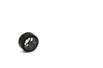 Obraz na płótnie Canvas Alloy wheel with (tire or tyre) of car model plastic kit isolated on white background.