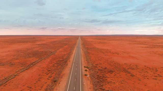 Straight Road in the red Australian desert (aerial drone view)