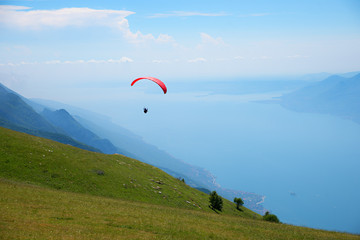 tandem flight from monte baldo mountain, view to garda lake, italy north