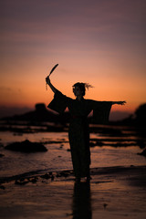 Silhouette of Japanese Geisha in kimono with fan