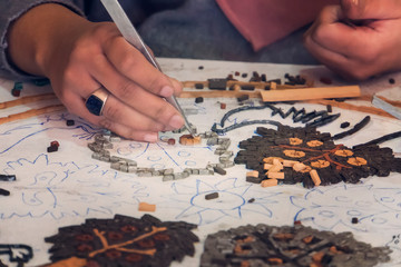 Artist, Mosaic Tools, Hand Craft, Uses Tweezers To Make Mosaic, Close Up. Ancient process making mosaics.