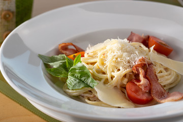 Traditional italian pasta. Carbonara pasta. Spaghetti with pancetta, egg, parmesan cheese and cream sauce. Traditional italian cuisine. Dish of Spaghetti alla Carbonara, typical italian recipe