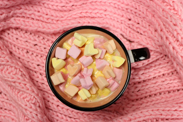 Colorful marshmallows hearts in a cup of tea or coffee