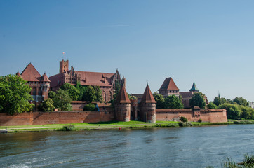 Fototapeta premium Castle of the Teutonic Order in Malbork, Poland. It is the largest castle in the world. Brick castle.