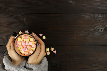 Colorful marshmallows hearts in a cup of tea or coffee. copy space for your text