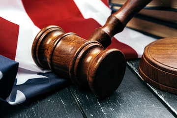 Judge gavel on the background of the flag united states of America