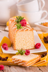 Lemon sponge cake with pomegranate.