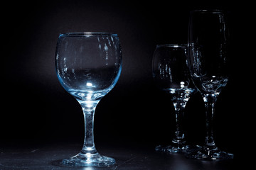 Empty  glasses for drinks on dark background