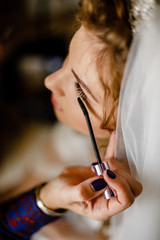 woman applying makeup