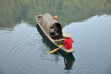 fishman and the boat floating in the lake