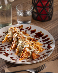 Traditional belgian waffles with fresh fruit and whipped cream. fresh crispy waffles with fruits and whipped cream. Homemade Belgian Waffles with Chocolate Cream Sauce Banana Walnuts