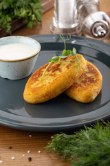 Potato patties (zrazy) Stuffed with minced meat, served with sour cream and tomato sauce. Crisp potato cutlets with meat, mushrooms and cheese. Traditional Russian food Zrazy