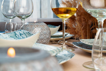 Table setting with stylish dishware on beige tablecloth