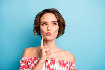 Closeup photo of pretty lady dreamer look side empty space deep thinking hold finger on chin wear...