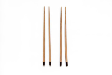 Wooden pairs of chopsticks on white background. cooking culture in Asian countries.