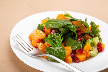 Delicious fresh salad. Spring salad with fresh vegetables. Close up view on Salad. Healthy, diet tasty summer dish
