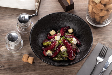 Delicious fresh salad. Drunk Pear Salad. Restaurant food, close up.