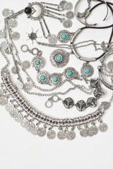 Bohemian style silver jewelry on white