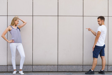 Man point finger at girl.