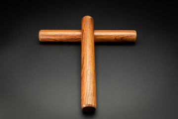 A pair of wooden claves lying on a black underground