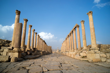 A view looking down the Cardo showing stone carved columns and paved street at the ancient city of...