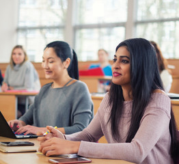 Lecturer and multinational group of students in an auditorium