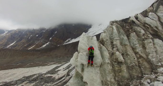  Himalayan mountaineers at Himalayas,upper Himalayan Range,Uttarakhand crossing ice mountains peaks (ice Craft) Ice axe use for climbing the peak 