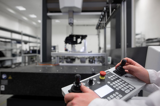 Quality engineer measuring some moldings by professional 3D measuring system machine, industrial concept