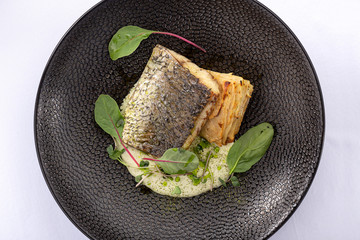 Oven-baked Sea bass. grilled fish.