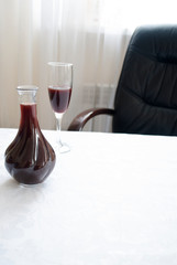 glass of wine and carafe on the table