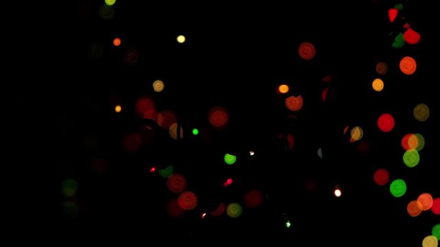 blinker bokeh flash multi color light in christmas tree in holiday