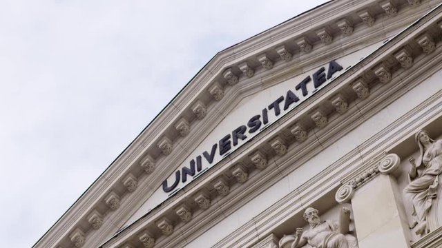 Slow motion shot of a Romanian University building. Classical architecture pediment