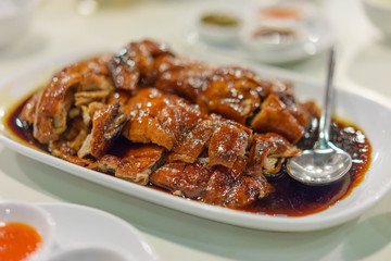 Cantonese style roasted duck at a restaurant in Bangkok, selective focus.
