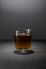 alcohol drink in glass on grey background