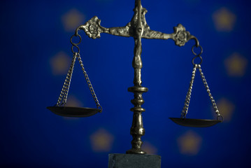 Law and Justice concept. UE flag background, place for typography. Courtroom Europe theme.