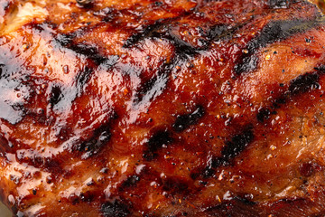 Grilled meat texture. Big juicy grilled beef steak close up