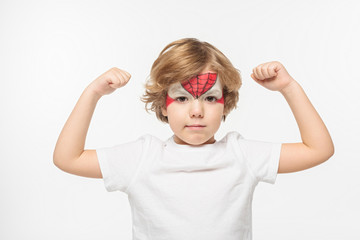 adorable boy with spiderman mask painted on face demonstrating power isolated on white © LIGHTFIELD STUDIOS