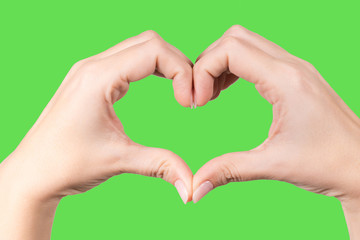 Closeup point of view photography of two white female hands forming heart shape gesture isolated on...