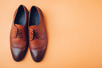 Oxford male brogues shoes. Men's fashion. Classical brown leather footwear.