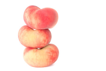 Heart-shaped donut peaches isolated on white background