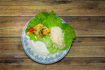 Flat view of plate with baked fish