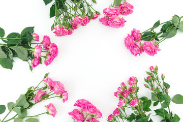 Floral frame with pink roses flowers on white background. Flat lay
